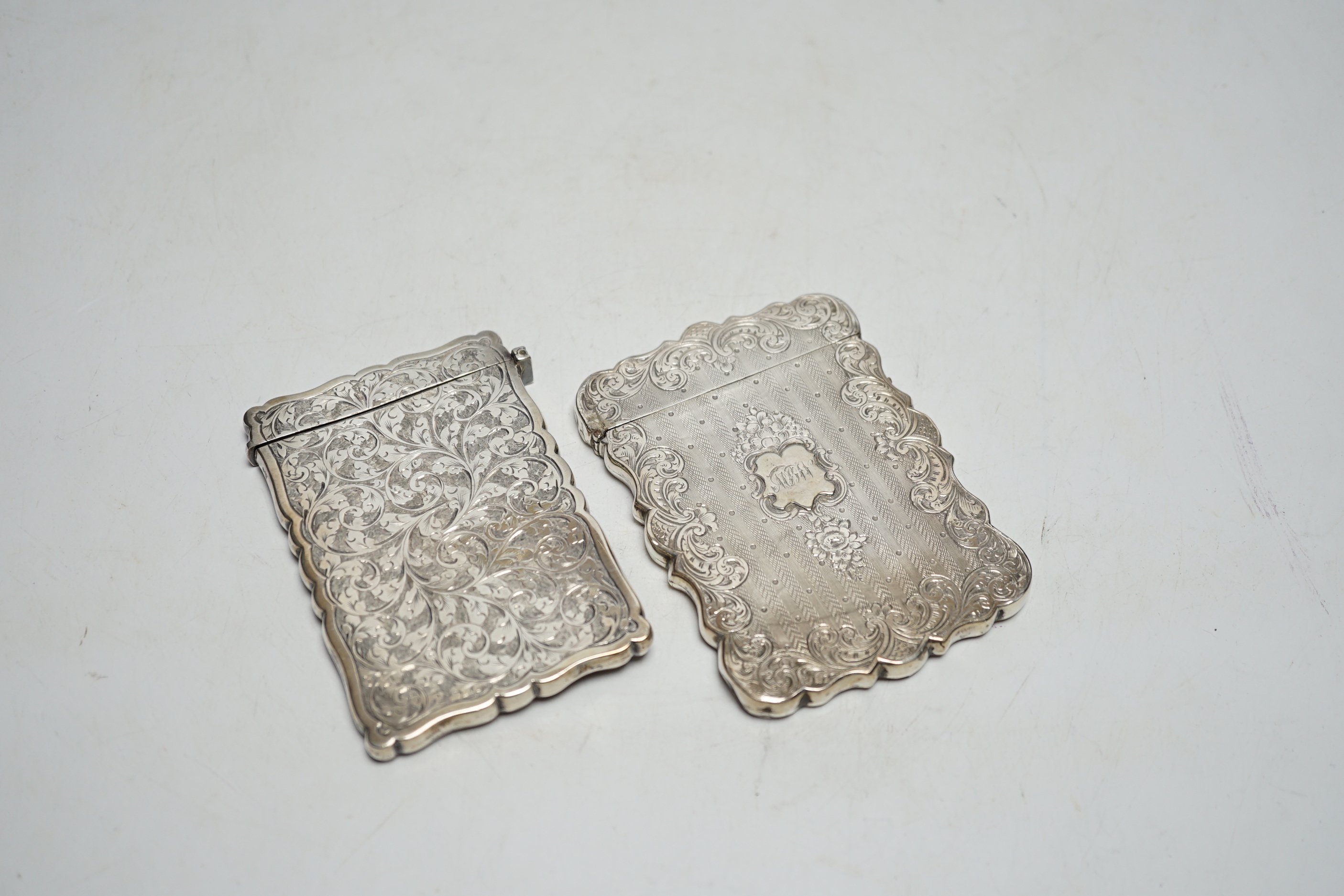 Two Victorian engraved silver card cases, largest by Hilliard & Thomasson, Birmingham, 1850, 10.1cm.